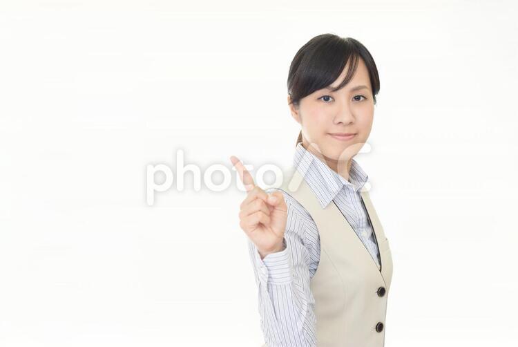 指示する笑顔のビジネスウーマン 女性,ビジネスウーマン,女の写真素材
