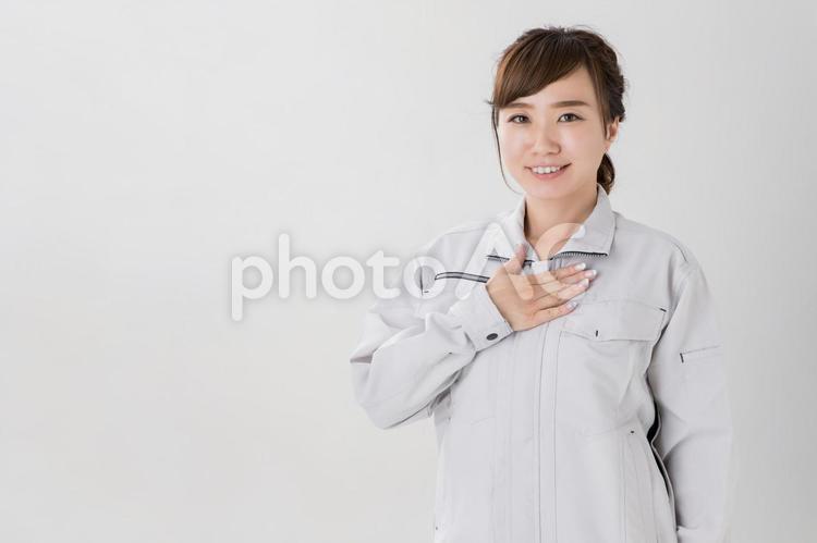 作業服をきたビジネスウーマン 作業服,女性,信頼の写真素材