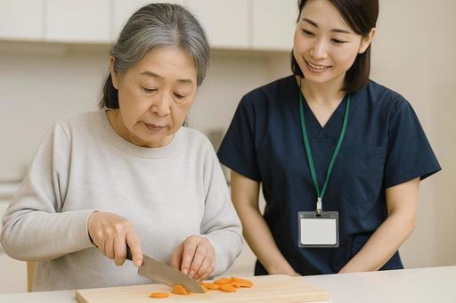 料理療法をする女性と作業療法士 料理療法をする女性と作業療法士の写真