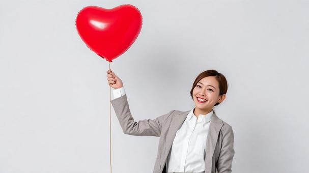 笑顔で推しへの愛を表現する女性 笑顔で推しへの愛を表現する女性の写真