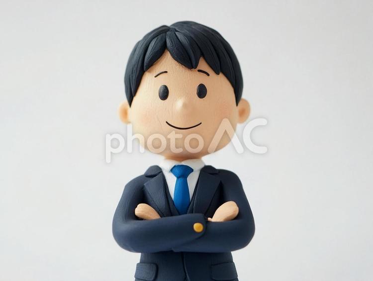 腕組みで考えるビジネスマンのクレイアート 男性,ビジネスマン,悩むの写真素材