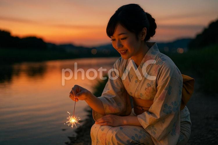 線香花火を見つめる浴衣女性 浴衣,女性,花火の写真素材