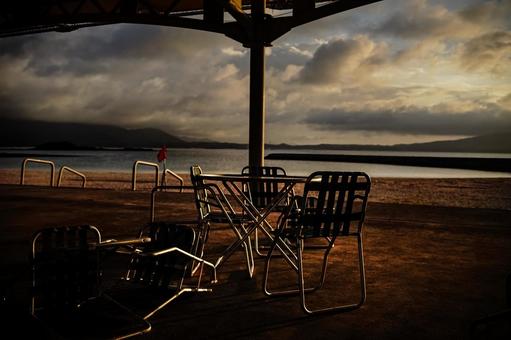 <Material> Table and chairs at a beach hut at dawn, JPG