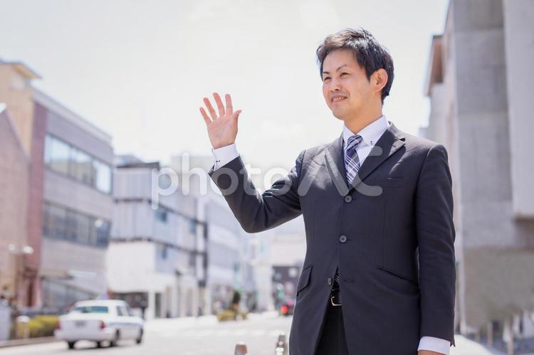 外回りする会社員 ビジネスマン,待ち合わせ,タクシーの写真素材