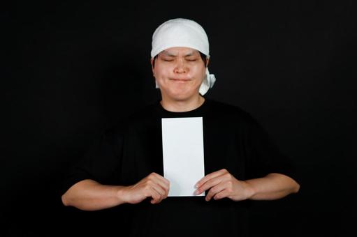 白い手ぬぐいの男性 男性,手ぬぐい,黒い服の写真素材