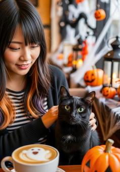 ハロウィンの猫カフェで黒猫を撫でる女性 ハロウィンの猫カフェで黒猫を撫でる女性 黒猫,女性,カフェの写真素材