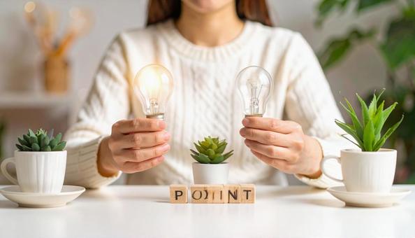 白いセーターの女性の両手の前にPOINT 白いセーターの女性の両手の前にPOINTの写真