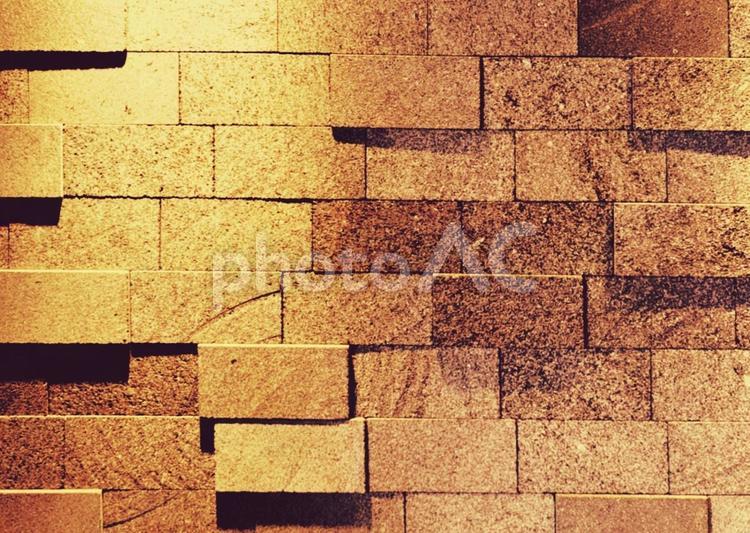 黄金色の石目調の外壁　おしゃれシック背景 壁,石目調,黄金色の写真素材