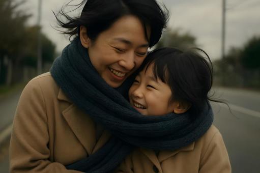 母子のマフラー散歩 母子のマフラー散歩の写真