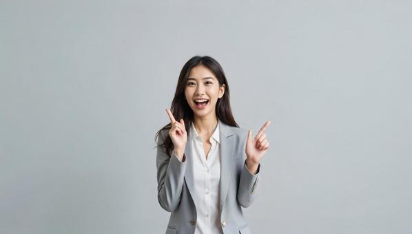 指差しで提案する笑顔の女性(AI生成) 指差しで提案する笑顔の女性(AI生成)の写真