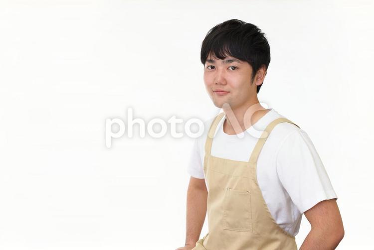 エプロン姿の男性 男性,エプロン,主夫の写真素材