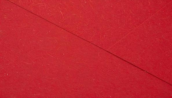 質感のある赤の和紙素材の写真