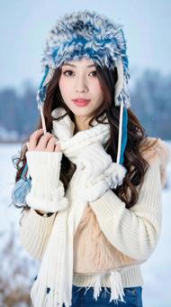 冬の寒冷な雪原の中の可愛い女性の写真