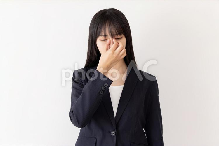 眼精疲労　ビジネスウーマン　ネガティブ 女性,ビジネスウーマン,スーツの写真素材
