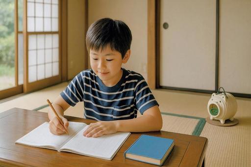 夏休みの宿題をする男の子 夏休みの宿題をする男の子の写真