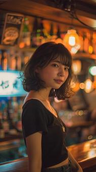 バーに居るスレンダーな美女 バーに居るスレンダーな美女の写真
