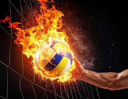 炎をまとったバレーボールのイメージの写真