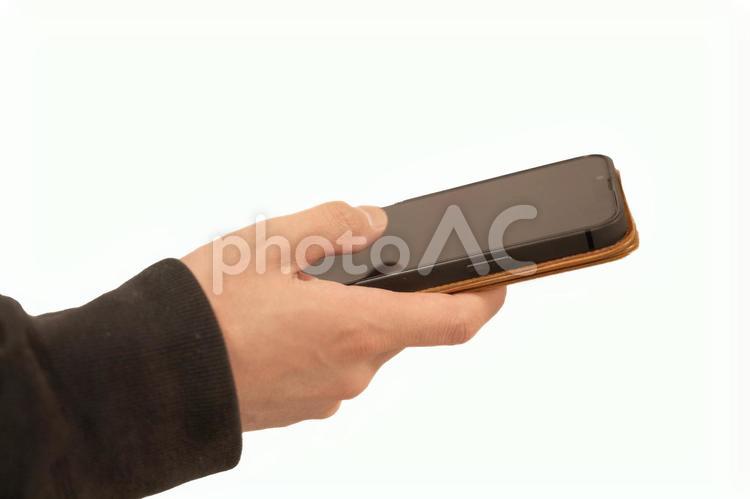 スマホを操作する親指 スマホ,操作,手の写真素材