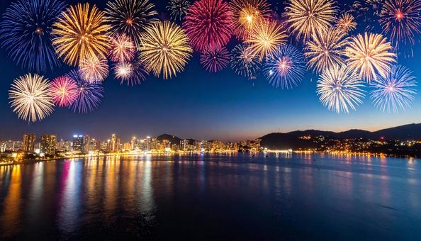 打ち上げ花火と街の夜景 打ち上げ花火と街の夜景の写真