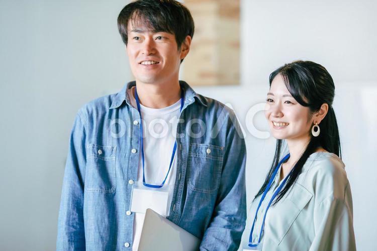 デスクワークの男女の会社員 システムエンジニア,デザイナー,ビジネスの写真素材