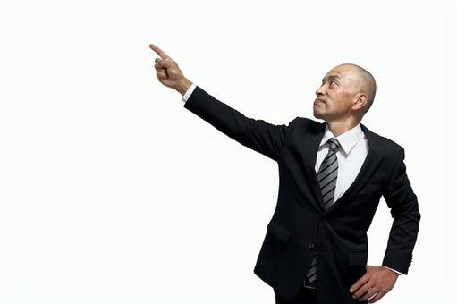 斜め上を指差してステップアップを目指す男 男性,ビジネス,スーツの写真素材