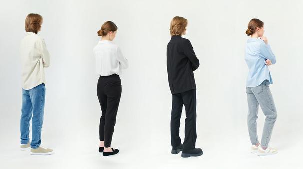 腕組みをして立つ外国人男女の横顔 腕組みをして立つ外国人男女の横顔の写真