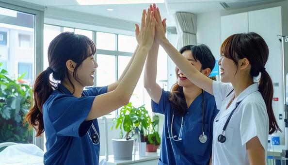喜びを分かち合う看護師・医者 喜びを分かち合う看護師・医者の写真