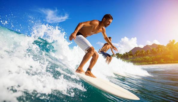 大波に乗るサーファーの写真