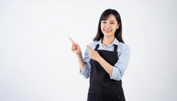 指差しをしている30代の女性 指差しをしている30代の女性の写真