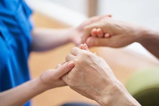 Hands of caregivers and the elderly Hands of caregivers and the elderly