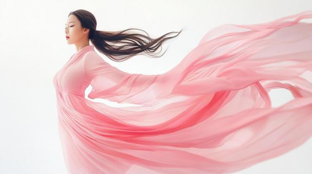 風に舞うピンクドレス 風に舞うピンクドレスの写真
