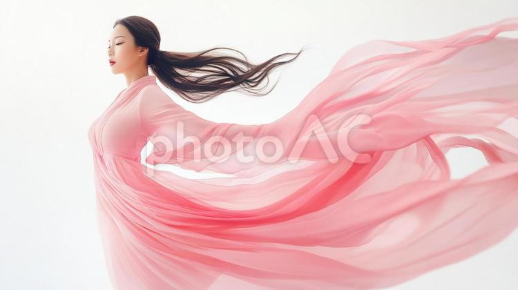 風に舞うピンクドレス 女性,ピンク,ドレスの写真素材