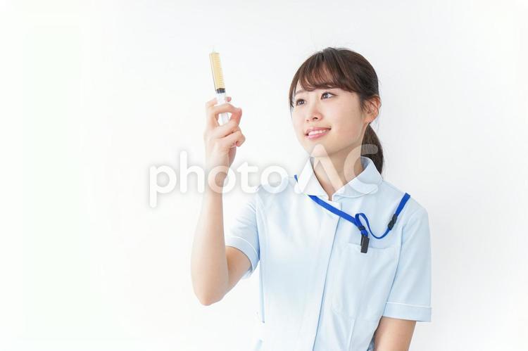 注射器を持つ看護師 女,女性,女子の写真素材
