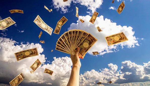 一万円を持つ手 青空背景 一万円を持つ手 青空背景の写真