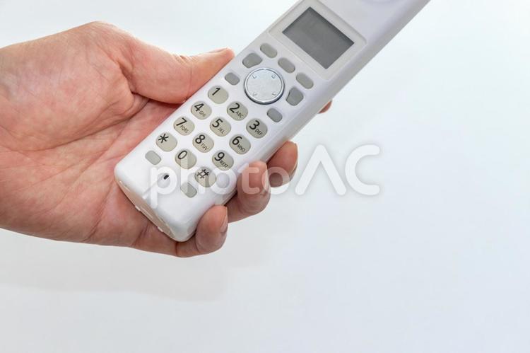 電話をかける 受話器,子機,電話の写真素材
