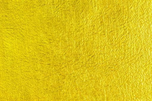 ざらざらした金色の和紙の写真