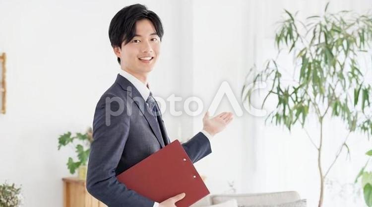 不動産の案内をするビジネスマン ビジネスマン,男性,不動産の写真素材