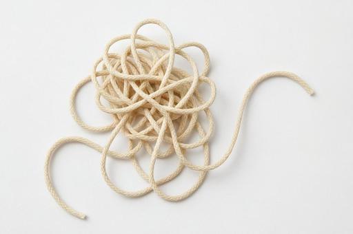 ほどけかけた絡まった紐・問題解決・混乱 ほどけかけた絡まった紐・問題解決・混乱の写真