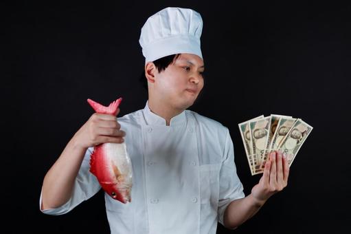 魚とお金を持つ料理人 魚とお金を持つ料理人 料理人,シェフ,魚の写真素材
