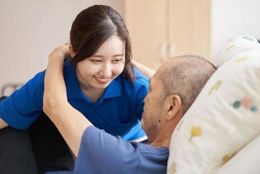 Female caregiver with an elderly person Female caregiver with an elderly person