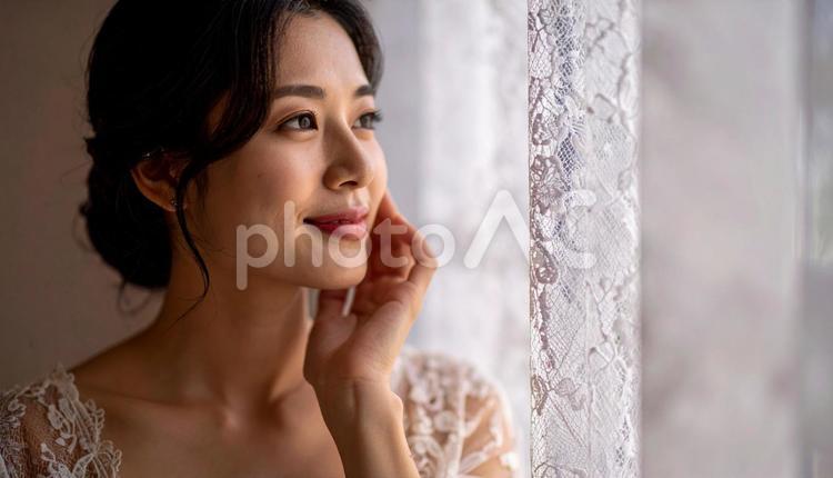 ビューティイメージ　頬をさわる女性 頬,横顔,化粧の写真素材