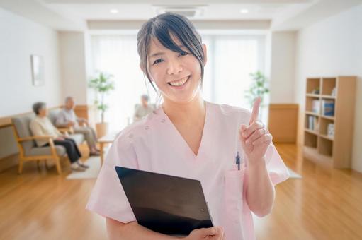 指差す医療女性 女性,介護士,看護師の写真素材