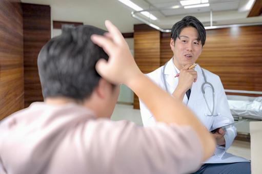 診察 診察 医師,男性医師,患者の写真素材