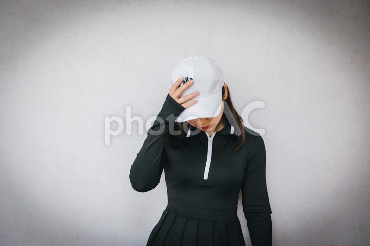 ゴルフウェアを着た女性が落ち込む ゴルフ,スポーツ,ゴルフスポーツの写真素材