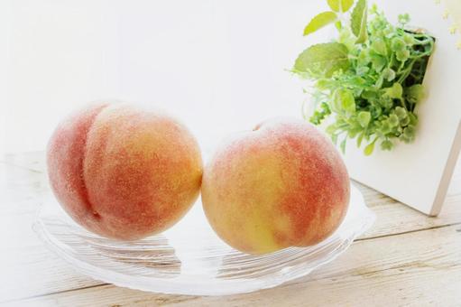 Two beautiful peaches on a glass plate, JPG Two beautiful peaches on a glass plate, JPG
