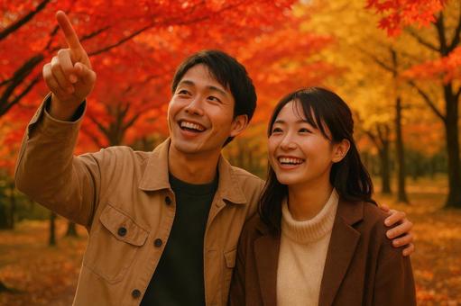 紅葉狩りを楽しむ若い恋人 紅葉狩りを楽しむ若い恋人の写真