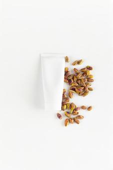 Pistachios and white tube (white background), JPG Pistachios and white tube (white background), JPG