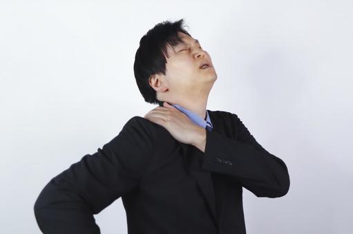 肩こりに苦しむビジネスマン 肩こりに苦しむビジネスマン ビジネスマン,肩こり,痛みの写真素材
