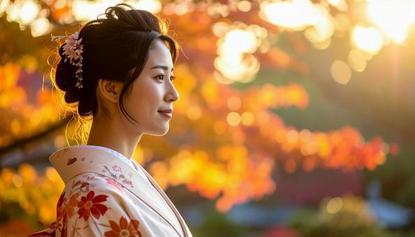 紅葉を眺める晴れ着姿の女性のポートレートの写真