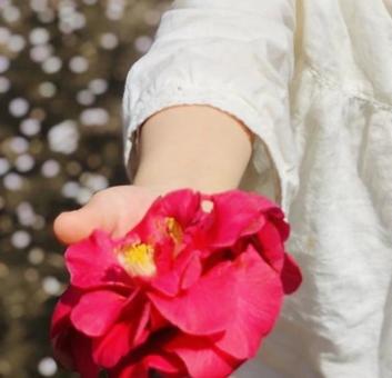 Child's hand with flowers, JPG
